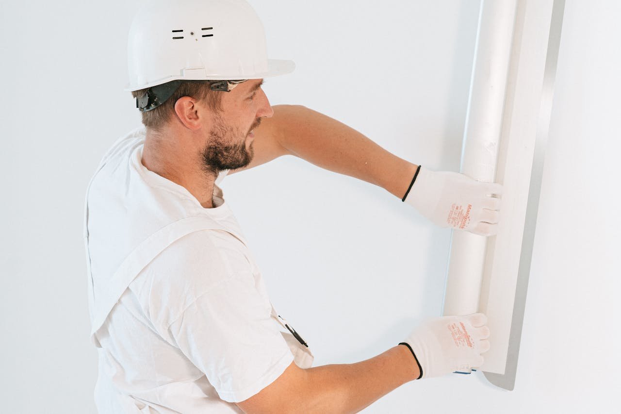 Professional installing drywall